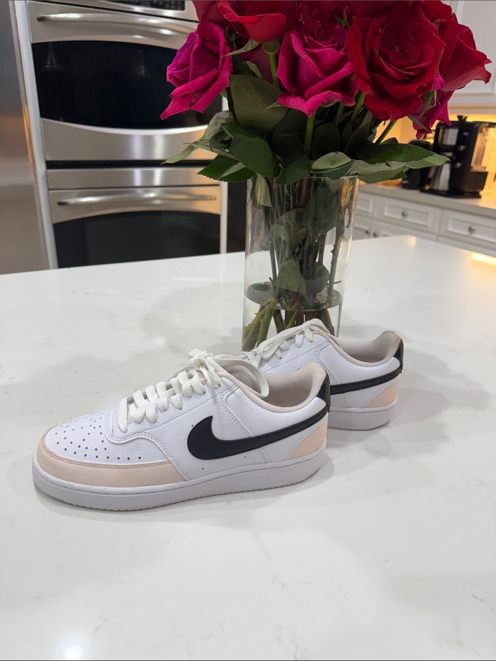 Nike White Low-Top Sneakers with Black Swoosh and Blush Accents
